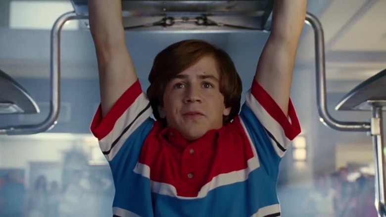 Will Stronghold (Michael Angarano) raises a lunch table with his super strength in Sky High