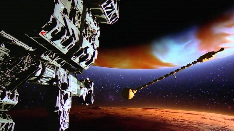 A spacecraft approaches the abandoned USS Discovery