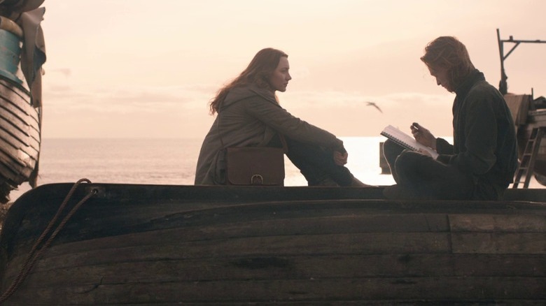 Eleanor and Frank sit and talk