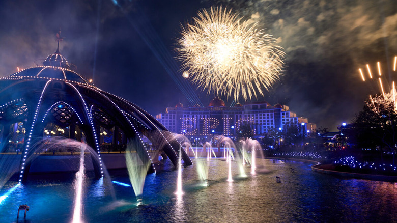 epic universe at night with fountains and fireworks