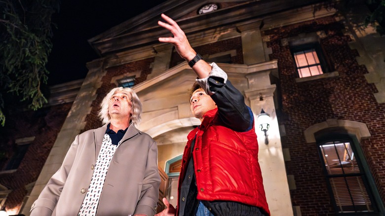 Marty and Doc confer outside the clocktower in Back to the Future: Destination Hill Valley