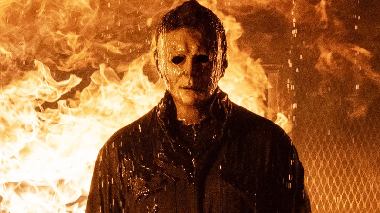 Michael Myers walking away from a fire