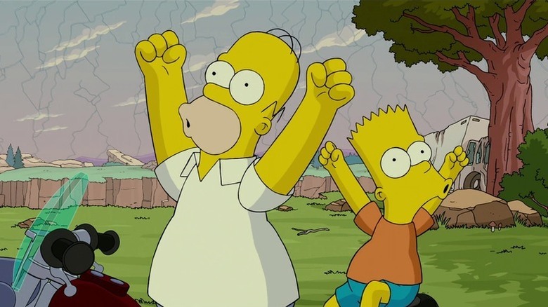 Homer Simpson (Dan Castellaneta) and Bart Simpson (Nancy Cartwright) cheer triumphantly in The Simpsons Movie