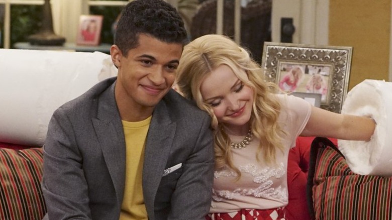 Jordan Fisher Dove Cameron cuddle on couch