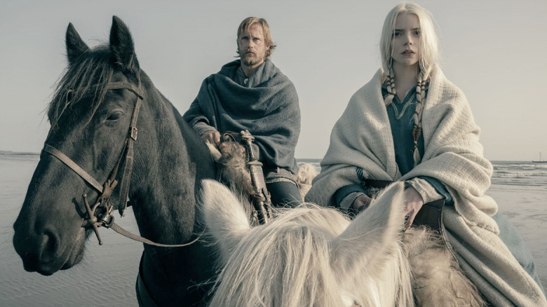 Alexander Skarsgard and Anya Taylor-Joy on horses