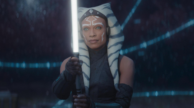 Rosario Dawson as Ahsoka Tano holding her lightsaber in the World Between Worlds in Ahsoka season 1
