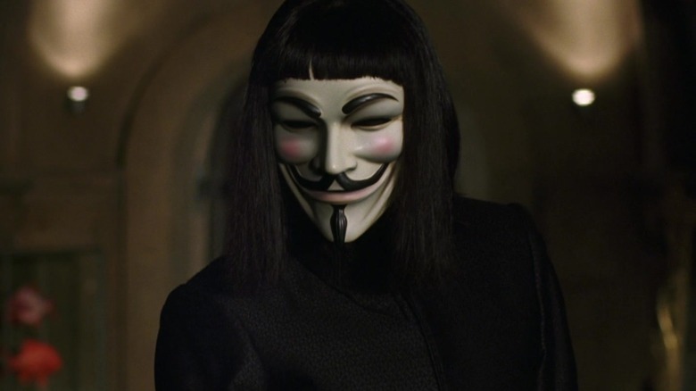 V standing with his mask on in V for Vendetta