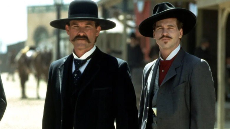Kurt Russell Val Kilmer wearing hat Tombstone