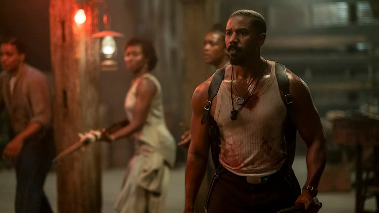 Smoke (Michael B. Jordan) and other survivors prepare to face off against vampires in Sinners