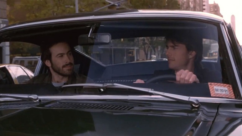 Tom Cruise as David driving with his best friend Brian, played by Jason Lee, in Vanilla Sky