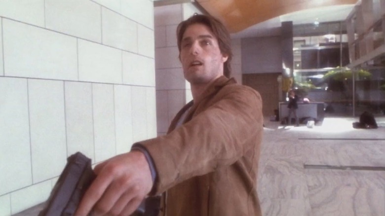 Tom Cruise as David Aames with a gun in the Vanilla Sky alternate ending