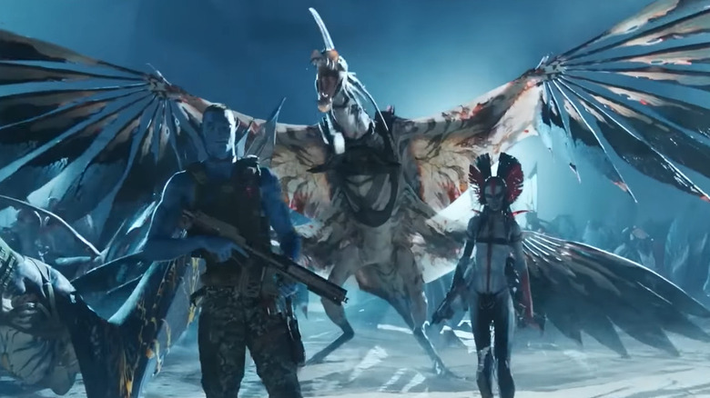 Quaritch and Varang walking away from a Nightwraith in Avatar: Fire and Ash