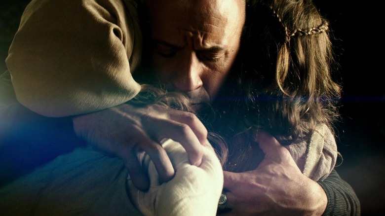 Vin Diesel as Kaulder hugs two kids in The Last Witch Hunter