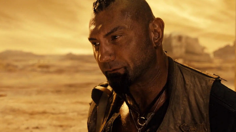 Dave Bautista as Diaz standing out in the open terrain in Riddick