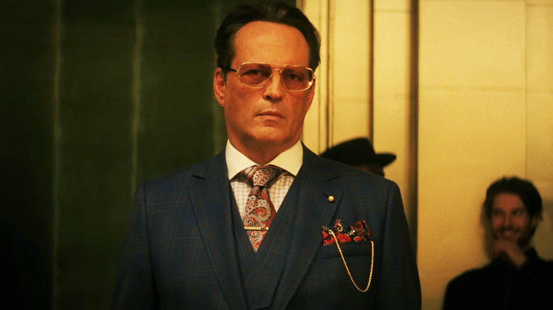 Vince Vaughn's Nick stands wearing a suit in Mike & Nick & Nick & Alice