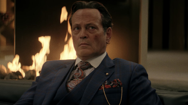 Vince Vaughn's Nick sits in front of a fireplace looking up in Mike & Nick & Nick & Alice