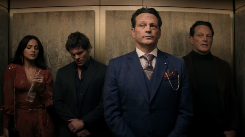 Vince Vaughn's Present Nick stands in and elevator while Vince Vaughn's Future Nick, James Marsden's Quick Draw Mike, and Eiza González's Alice stand behind him in Mike & Nick & Nick & Alice