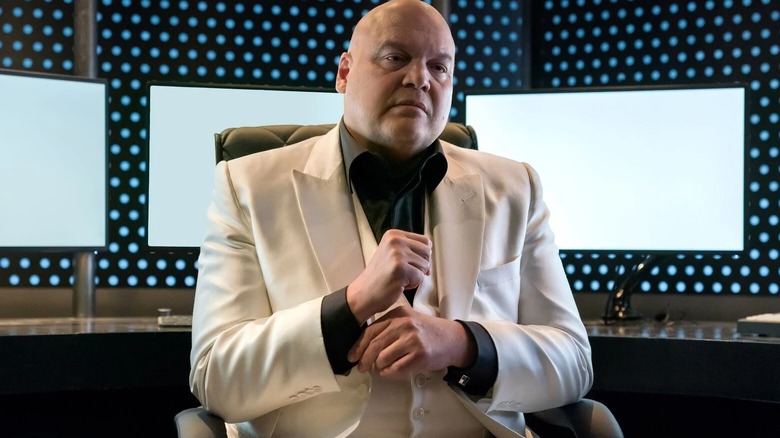 Wilson Fisk sits white suit