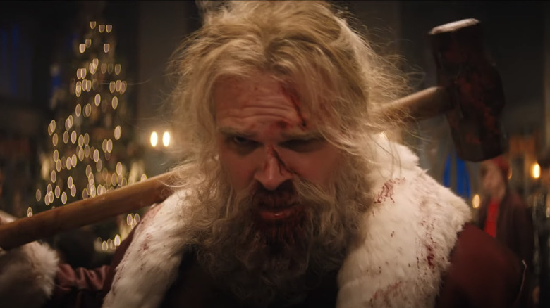 Violent Night santa with hammer