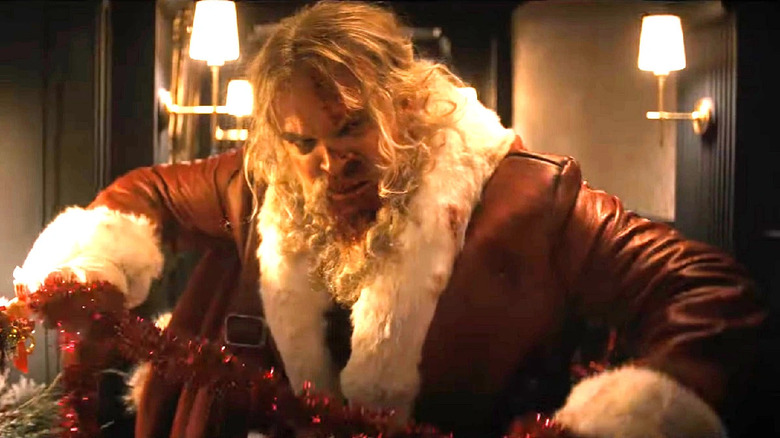 Violent Night santa with festive string
