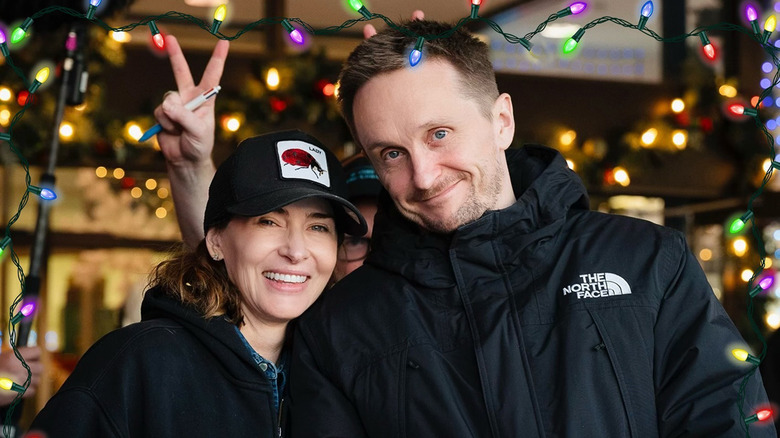 Kelly McCormick and Tommy Wirkola stand side by side on the Violent Night 2 set