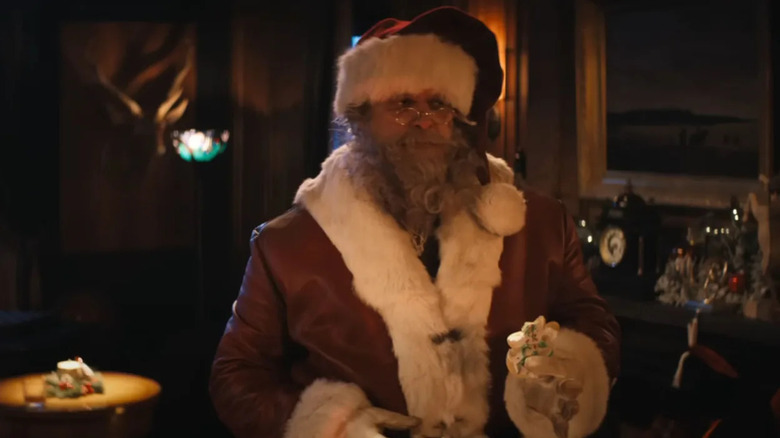 Violent Night santa eats a cookie