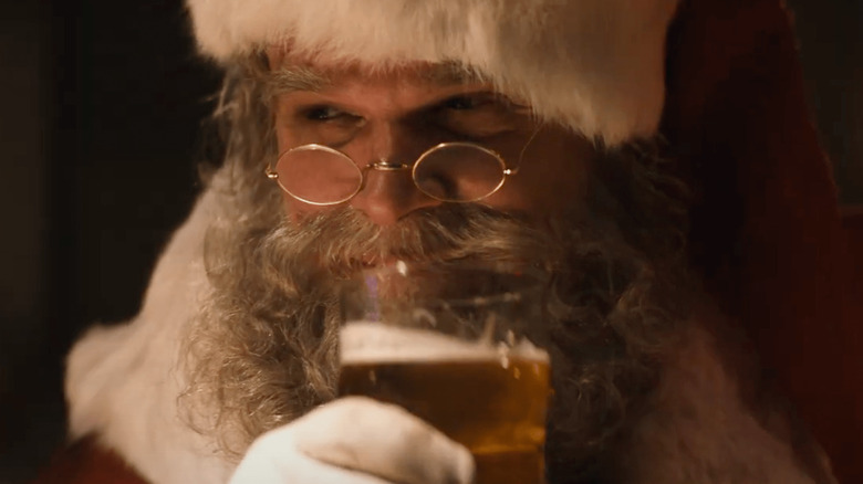 Violent Night santa having a beer