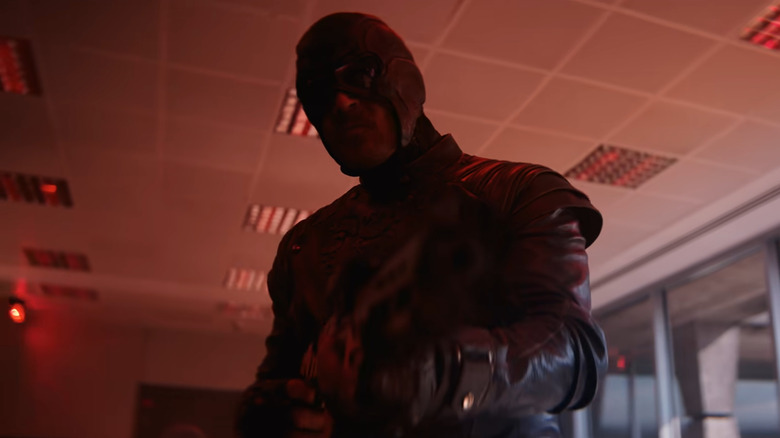 Todd Stashwick as Paladin wearing a mask and tactical gear while holding up a weapon in VisionQuest