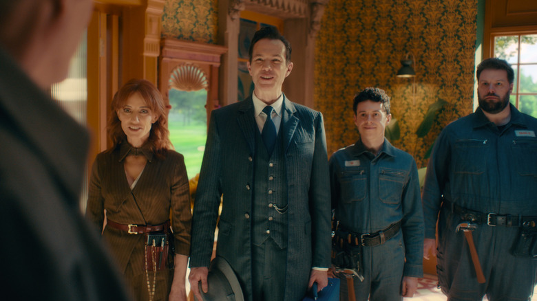 Dum-E, U, Jarvis, and Friday smiling as they welcome Vision back home in VisionQuest