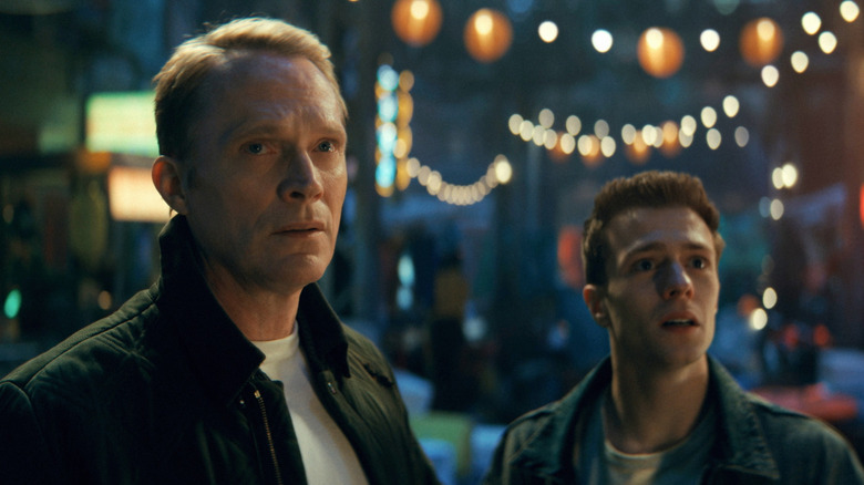 Vision (Paul Bettany) and Tommy (Ruaridh Mollica) stand on a street at night in VisionQuest