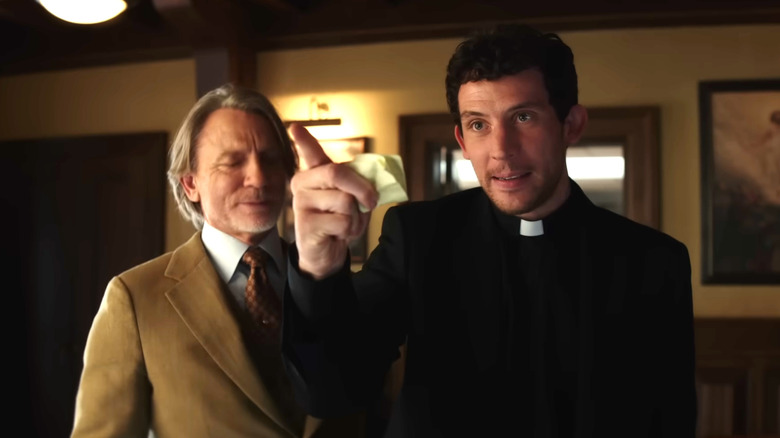 Wake Up Dead Man: A Knives Out Mystery, Father Jud telling off the group of suspects while Blanc watches in the background