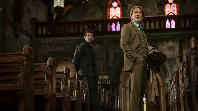 Jud and Benoit Blanc in a church in Wake Up Dead Man