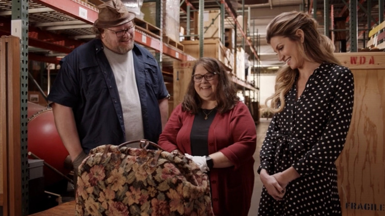 Dan Lanigan, Becky Cline, and Erin Andrews with Mary Poppins' carpet bag from Prop Culture