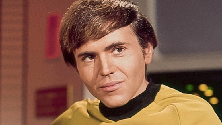 Walter Koenig sports a yellow uniform on the bridge of the U.S.S. Enterprise in Star Trek