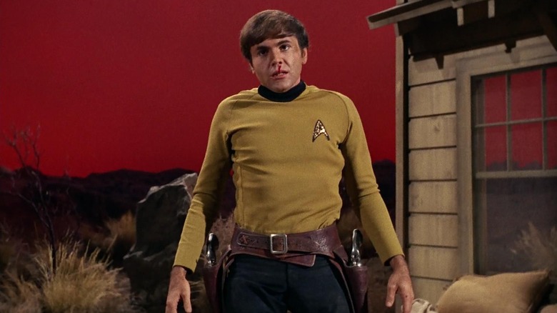 Chekov, bleeding from his nose, is trapped in a stylized version of Tombstone, Arizona on Star Trek