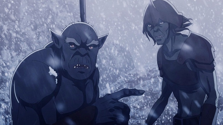 Two orcs look confused and a little disgusted while stuck in a snowstorm in War of the Rohirrim.