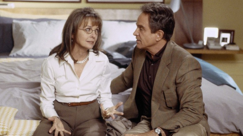Diane Keaton as Ellie Stoddard and Warren Beatty as Porter Stoddard sitting on a bed in Town & Country