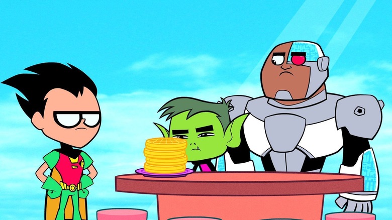 Robin and Cyborg looking at Beast Boy as he stares at a plate of waffles in Teen Titans Go!