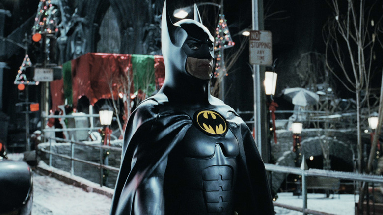 Michael Keaton's Batman stands on a snowy Gotham street in Batman Returns