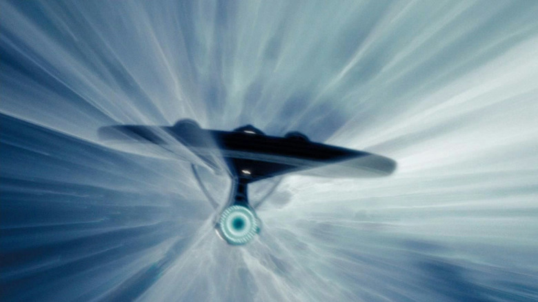 The USS Enterprise starship traveling at warp speed in Star Trek