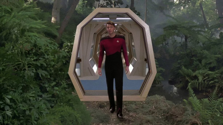Jonathan Frakes as William Ryker stepping onto the Holodeck in the middle of a jungle in Star Trek: The Next Generation