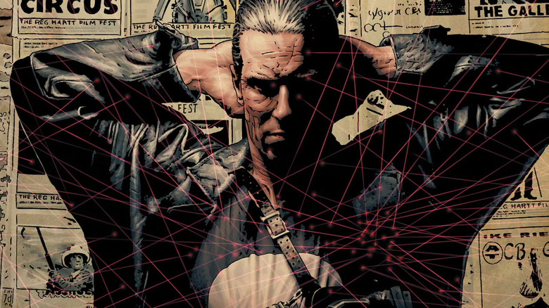 Punisher Max cover of Punisher standing in front of newspapers on wall with sniper dots all across his body