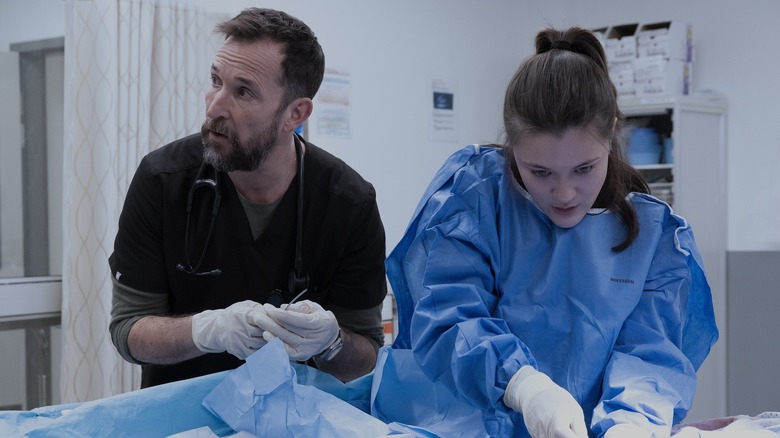 Robby and Santos performing a procedure on The Pitt