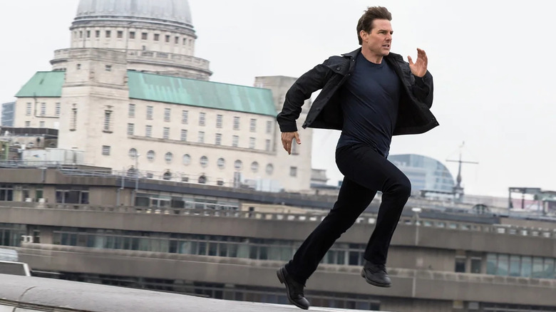 Tom Cruise as Ethan Hunt running away in Mission: Impossible - Fallout