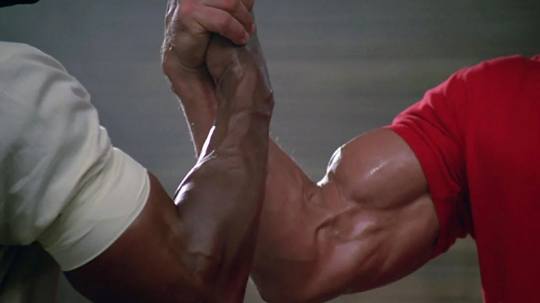 Dillon (Carl Weathers) and Dutch (Arnold Schwarzenegger) arm wrestling in "Predator."