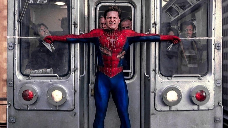 Spider-Man (Tobey Maguire) holding a train in "Spider-Man 2."