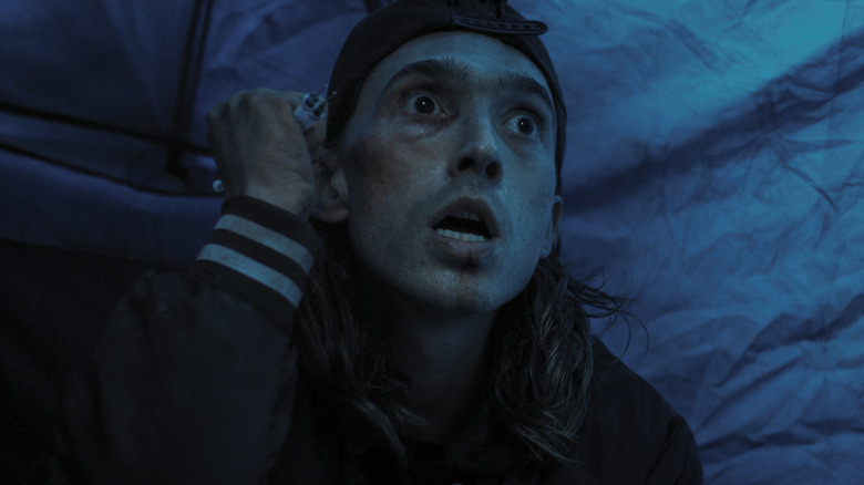 Austin Abrams holding syringes as James