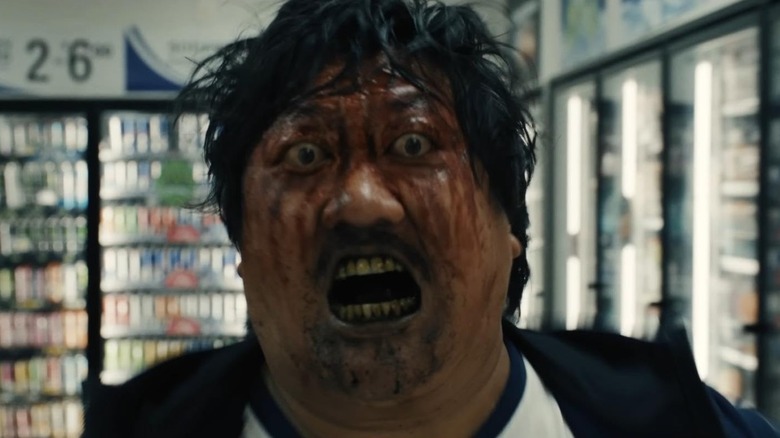 Marcus bloodied running through a supermarket
