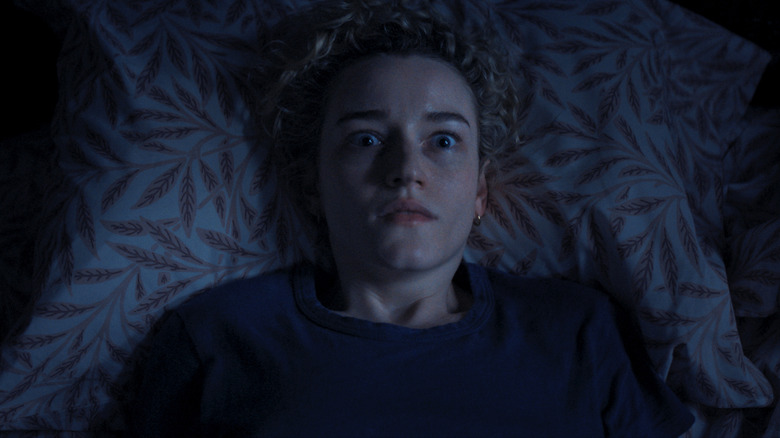 Justine Gandy is frightened in bed in Weapons