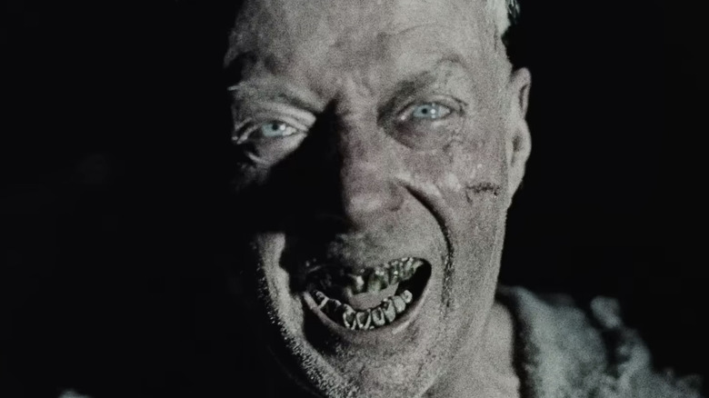 A scary guy with bad teeth in Werwulf